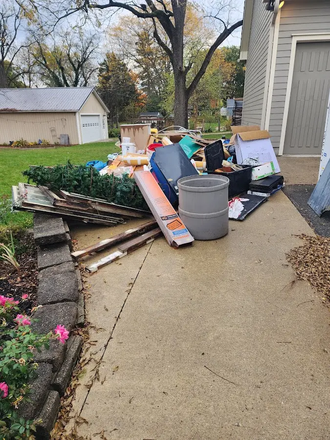 Dumpster being loaded with debris for Demolition Dumpster Rental in East Whittier